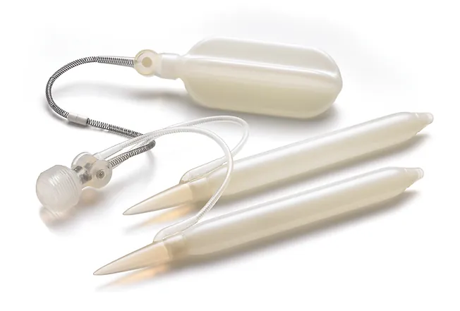 A three-piece inflatable penile implant of the type represented by the Rigicon Infla10