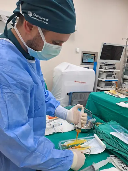 A surgeon preparing sterile instruments before an operation