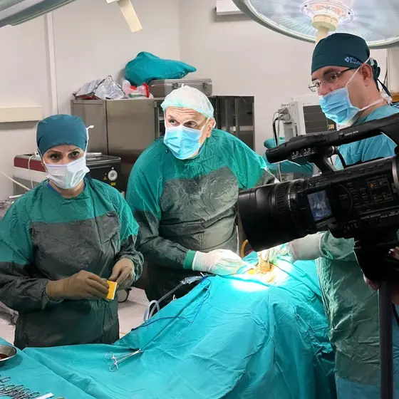 The surgical team at work while an operation is filmed