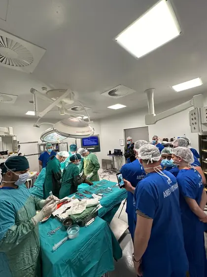 A wide view of a busy operating theatre
