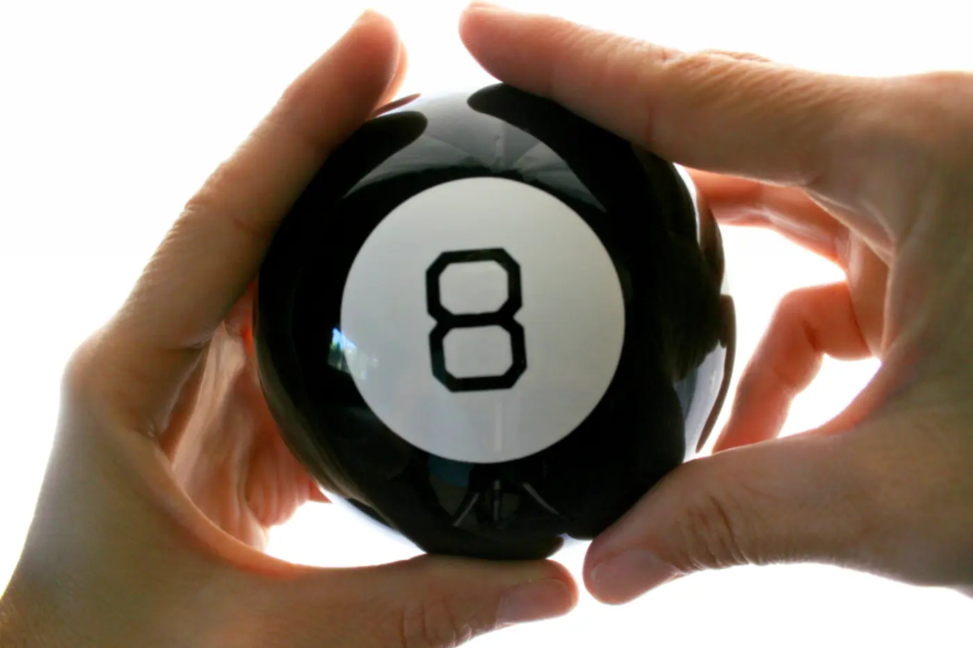 Hands holding a magic 8 ball