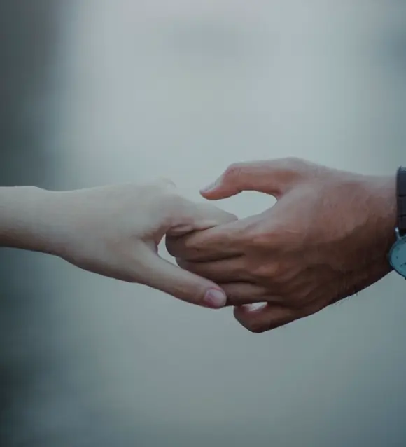 Close-up of a couple holding hands