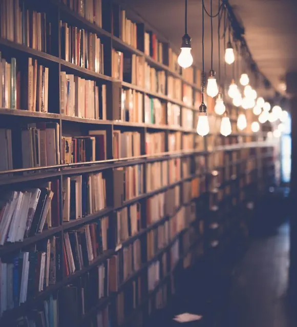 Long library corridor lined with bookshelves